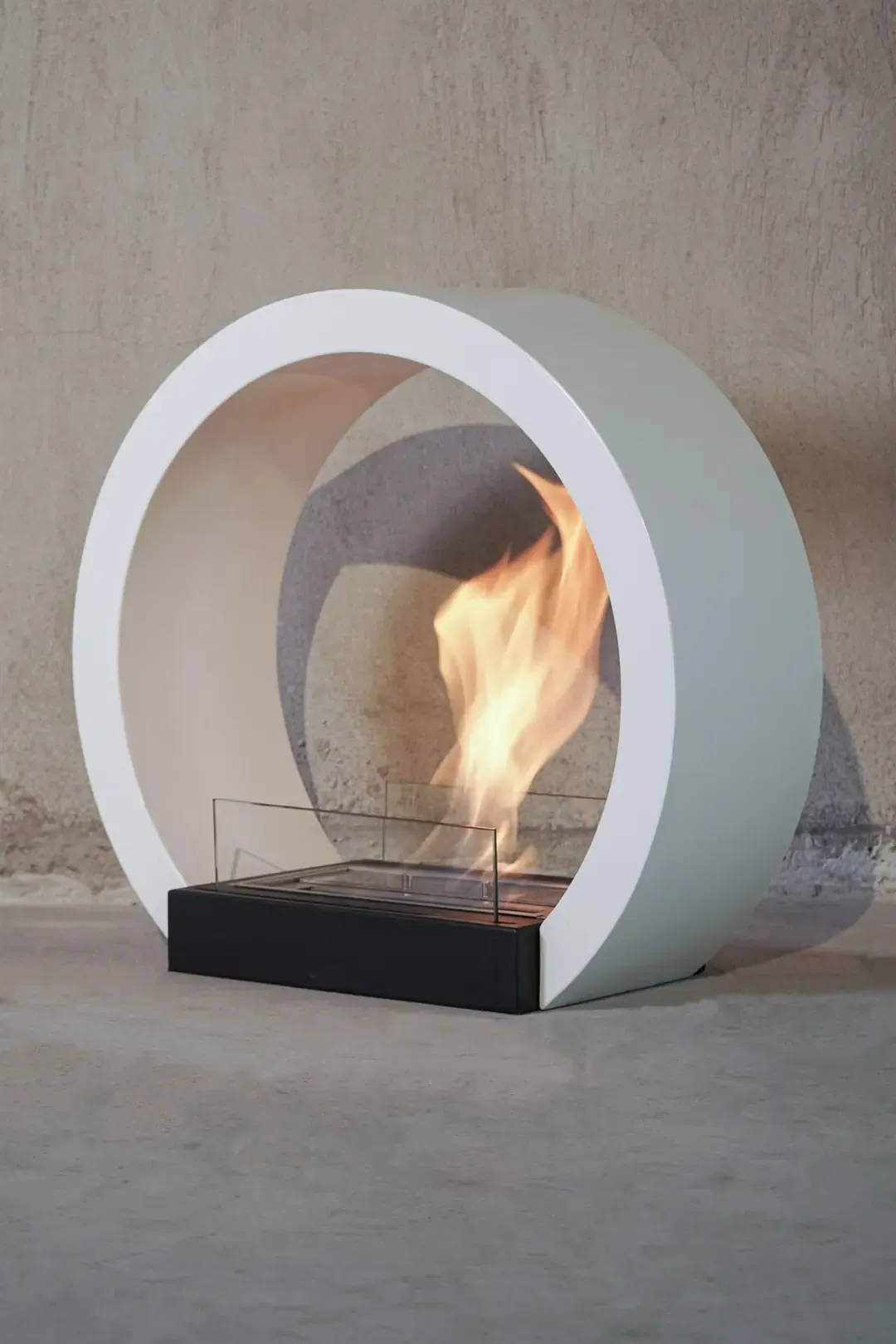 Agosto freestanding bioethanol fireplace with a white ring frame