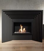 A modern fireplace with a black fire.